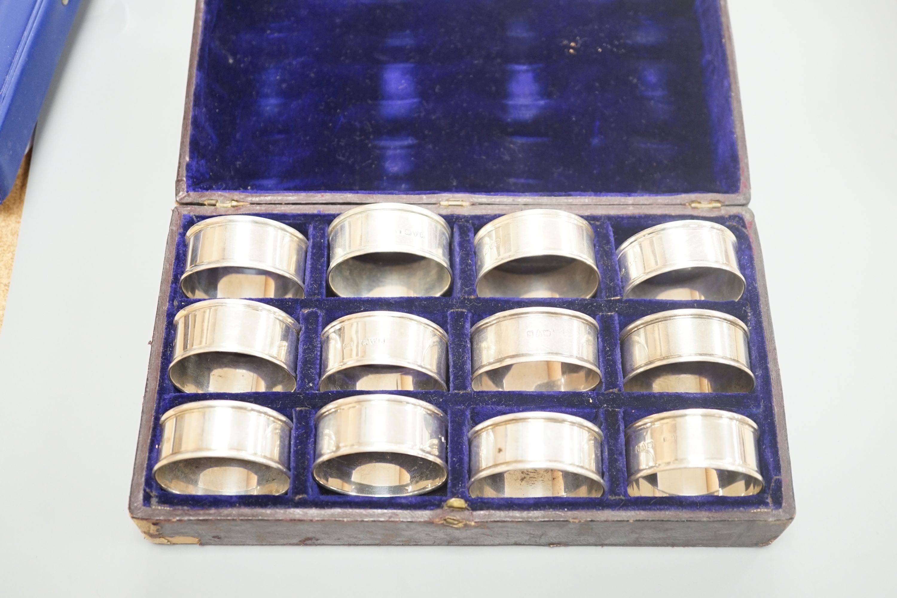 A cased matched set of twelve silver napkin rings by Charles Horner, Chester, various dates.